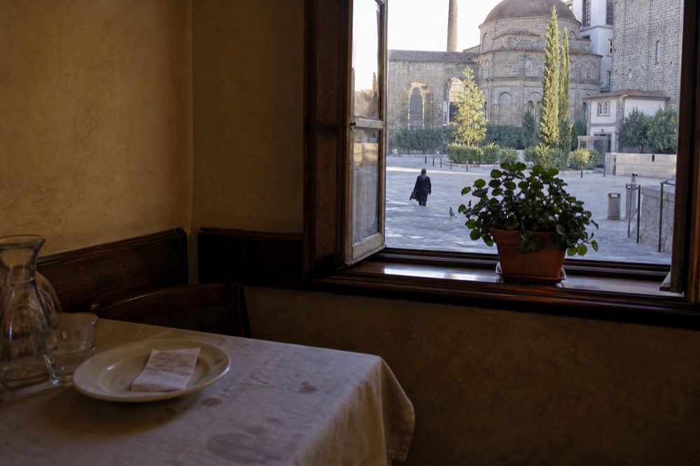 Florence restaurant interior with a bill on a plate, no text, no logos, no people
