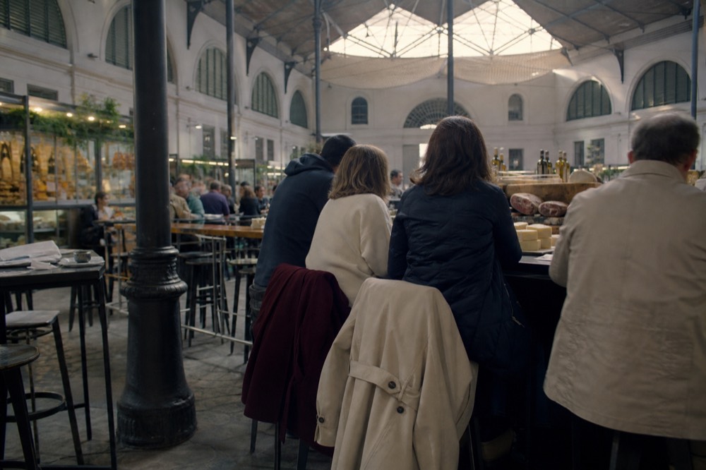 A Florence food tour group tasting at a market stall, no text, no logos, no people