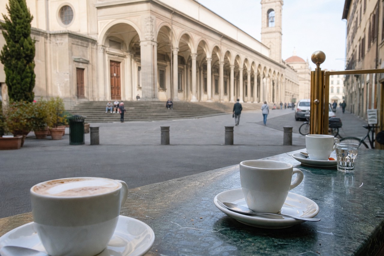Espresso cups and a cappuccino on a marble cafe counter in Florence, no text, no logos, no people