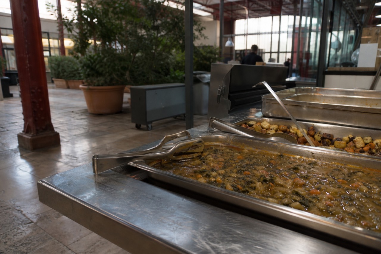 A Florence market counter with pans of cooked dishes, no text, no logos, no people