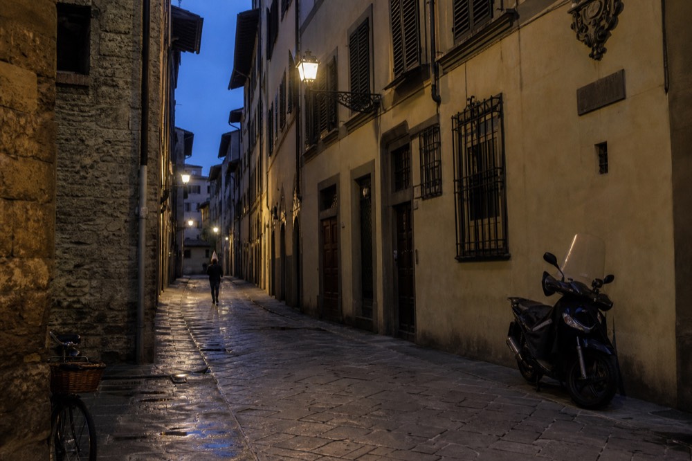 A narrow Florentine street near Santa Croce at dusk, no text, no logos, no people