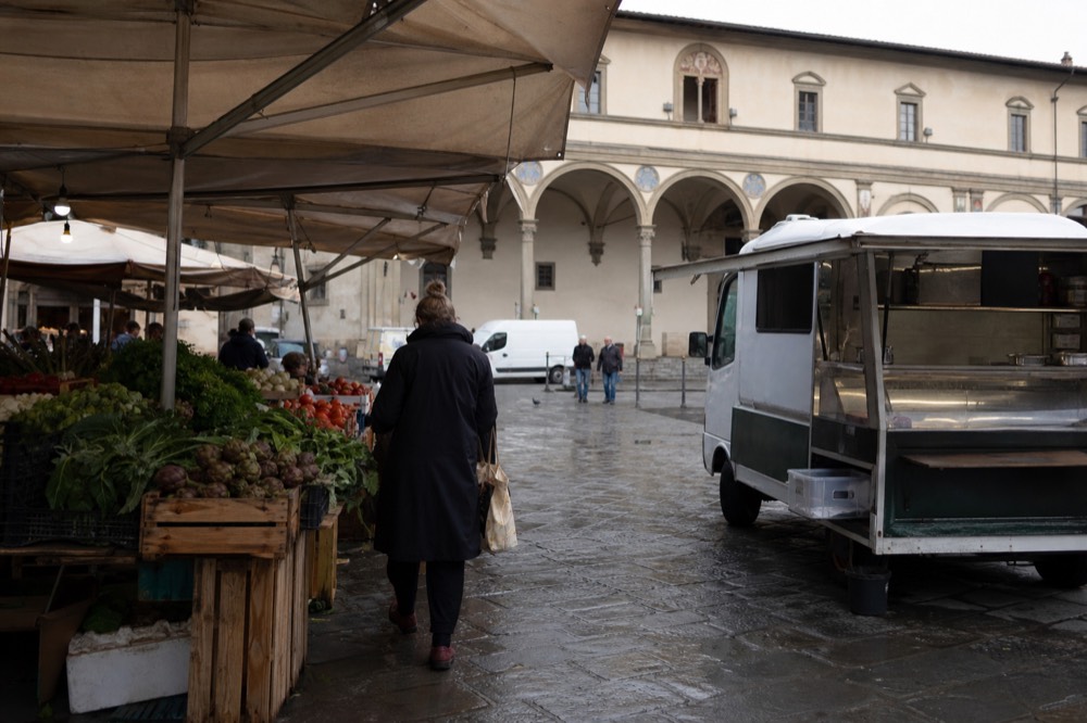 A Florence market square in the Sant'Ambrogio district with produce stalls, no text, no logos, no people