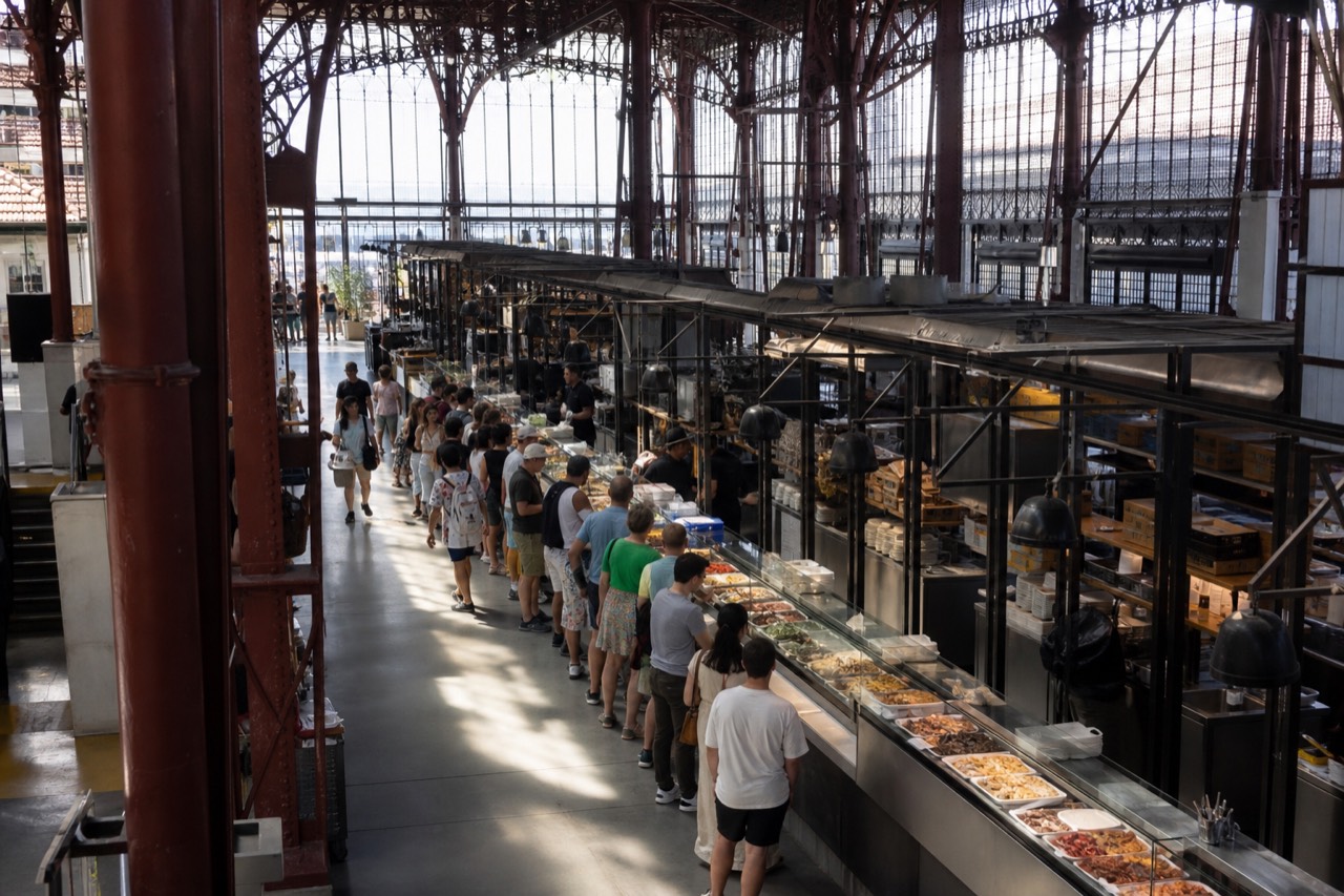 A busy Florence market counter at lunchtime with trays of prepared dishes, no text, no logos, no people