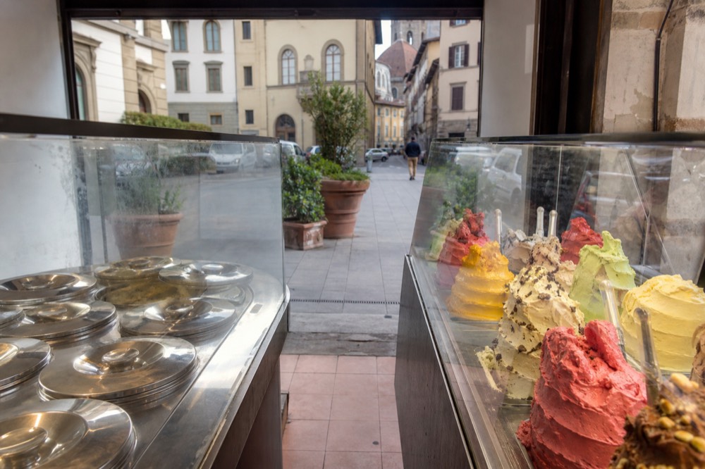 Two gelato displays side by side, one real and one fake, no text, no logos, no people