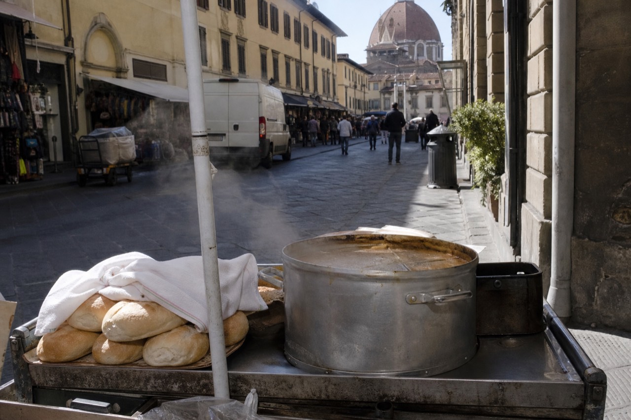 A Florence street food cart with bread rolls and a steaming pot, no text, no logos, no people