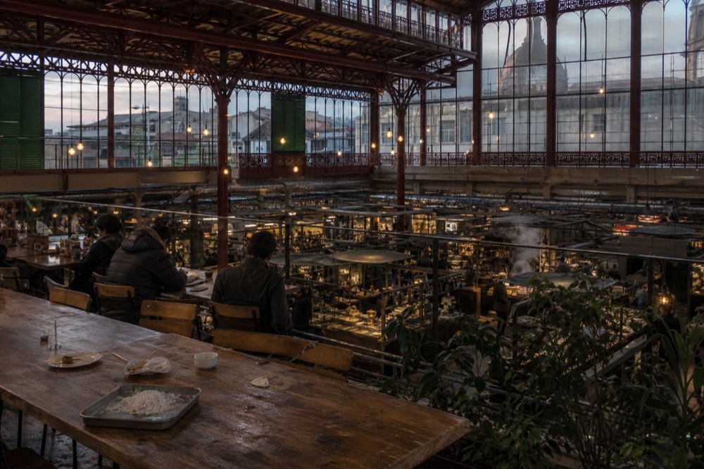 First floor food hall of Mercato Centrale with cooked food stalls and communal seating, no text, no logos, no people