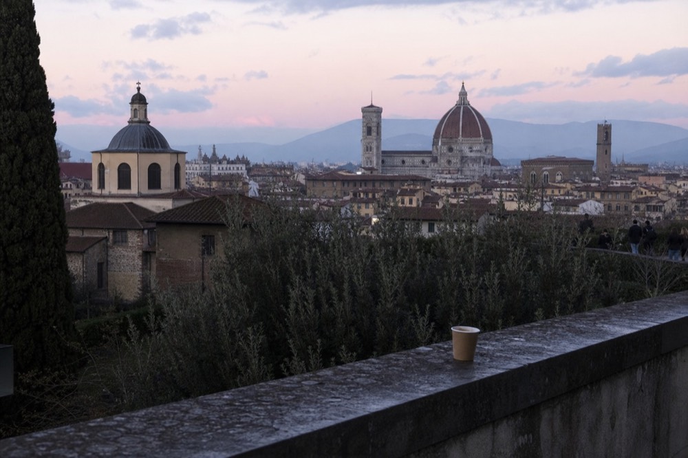 Florence skyline at dusk from a terrace, no text, no logos, no people